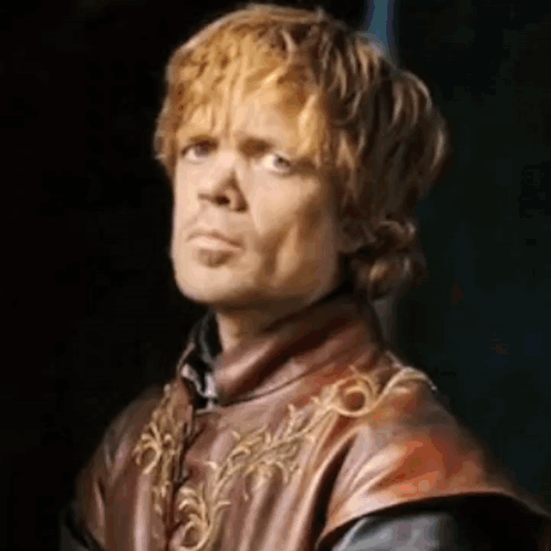 A Close Up Of A Man With Red Hair Wearing A Leather Vest And Making A Funny Face . GIF