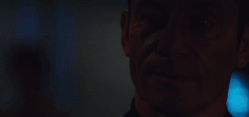 A Close Up Of A Man With The Words I Like To Think It Makes Me Mysterious GIF