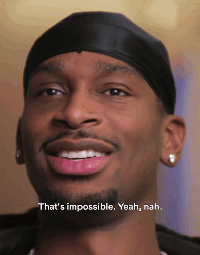 A Close Up Of A Man With The Words That 'S Impossible Yeah Nah GIF