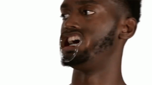 A Close Up Of A Man With The Words Warm Plum Pudding Behind Him GIF