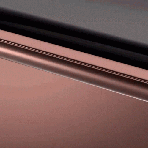 A Close Up Of A Metal Object With A Black Background . GIF