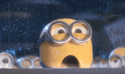 A Close Up Of A Minion 'S Face With A Hole In It GIF