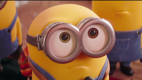 A Close Up Of A Minion Wearing Goggles And Making A Face GIF