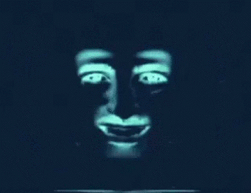 A Close Up Of A Monkey 'S Face With Glowing Eyes And A Smile . GIF