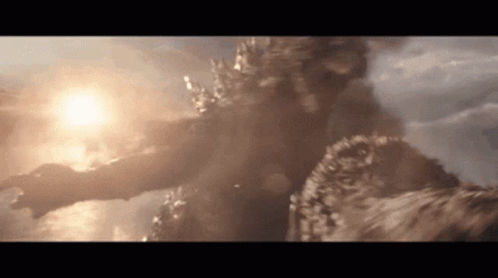 A Close Up Of A Monster Flying Through The Air With The Sun Shining Through The Clouds . GIF