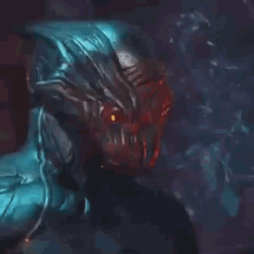 A Close Up Of A Monster In A Video Game With Red Eyes And A Blue Body . GIF