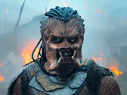 A Close Up Of A Monster 'S Face With A Fire Background GIF