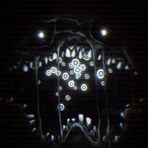A Close Up Of A Monster 'S Face With A Lot Of Eyes Coming Out Of It 'S Mouth . GIF
