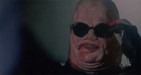 a close up of a monster 's face with blood on it 's mouth