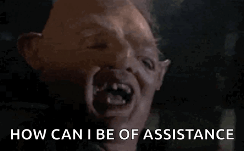 A Close Up Of A Monster 'S Face With The Words How Can I Be Of Assistance GIF
