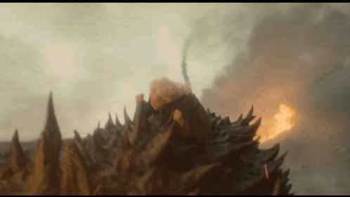 a close up of a monster 's head with flames coming out of it 's mouth