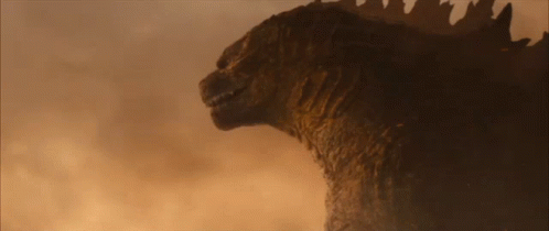 A Close Up Of A Monster 'S Head With Its Mouth Open GIF