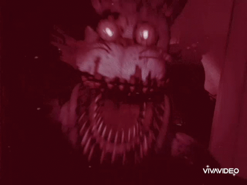 A Close Up Of A Monster 'S Mouth With Sharp Teeth And Eyes . GIF