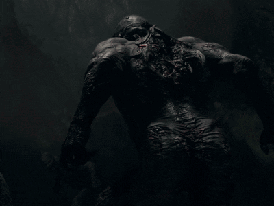 a close up of a monster with blood coming out of its mouth