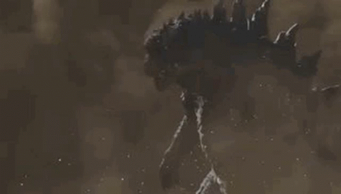 A Close Up Of A Monster With Its Mouth Open In The Sand . GIF
