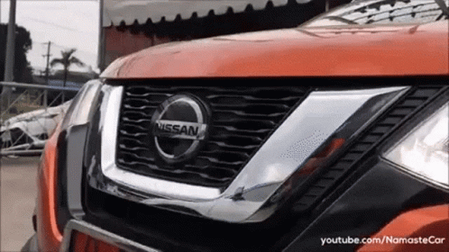 A Close Up Of A Nissan Car 'S Grille GIF