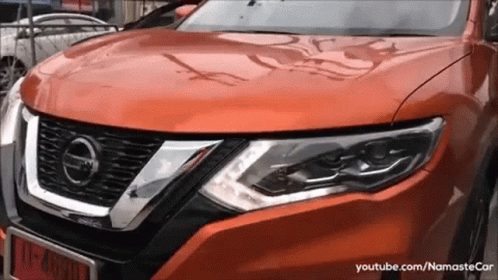 A Close Up Of A Nissan Car With A License Plate That Says 11-49301 GIF