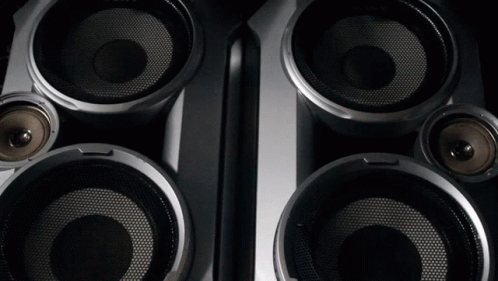 A Close Up Of A Pair Of Speakers With A Mesh Covering GIF