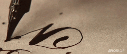 A Close Up Of A Pen Writing The Word Love GIF