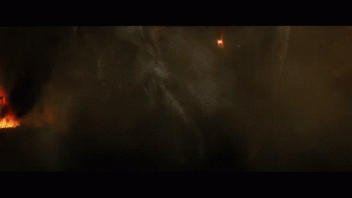 A Close Up Of A Person Being Struck By Lightning In A Dark Room GIF