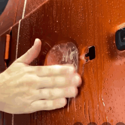 A Close Up Of A Person Cleaning A Car Door GIF
