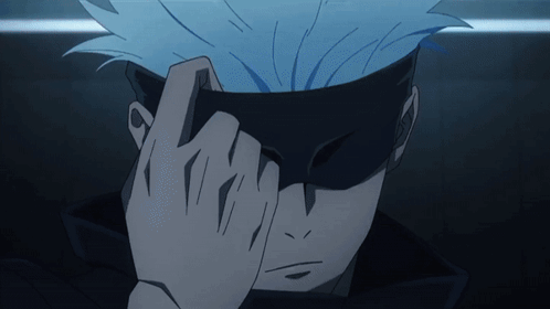 A Close Up Of A Person Covering Their Face With Their Hands GIF