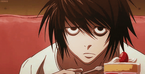 A Close Up Of A Person Eating A Piece Of Cake With Strawberries On Top GIF