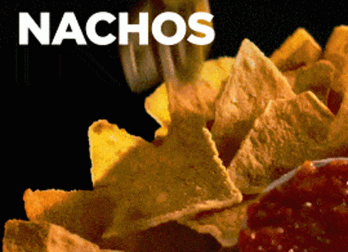 A Close Up Of A Person Eating Nachos With A Black Background GIF