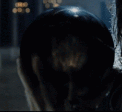 A Close Up Of A Person Holding A Glass Ball In Their Hand GIF