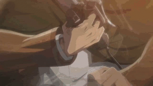 A Close Up Of A Person Holding A Gun In Their Hands . GIF