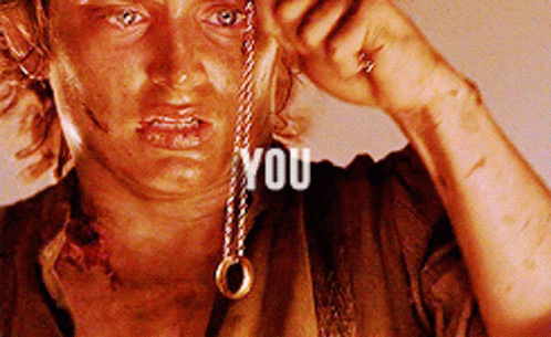 A Close Up Of A Person Holding A Necklace With The Word You Written On It GIF