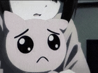 A Close Up Of A Person Holding A Stuffed Animal With A Sad Face . GIF