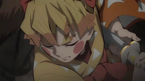 A Close Up Of A Person Holding A Sword In Their Hand GIF