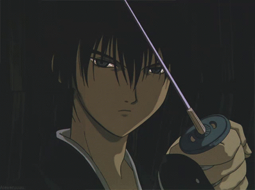 A Close Up Of A Person Holding A Sword With A Dark Background GIF