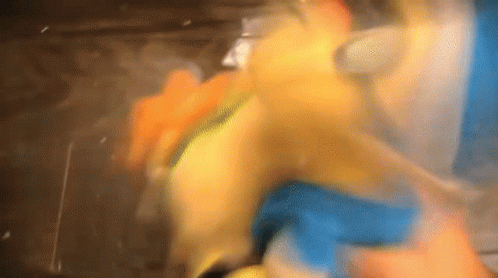 A Close Up Of A Person Holding A Yellow Object GIF