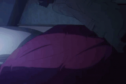 A Close Up Of A Person Laying Down With Their Eyes Closed And Their Mouth Open . GIF