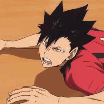 A Close Up Of A Person Laying On The Floor With Their Hands On Their Knees . GIF