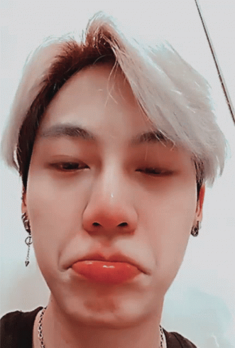 A Close Up Of A Person Making A Face GIF