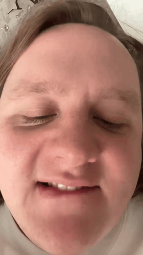 A Close Up Of A Person Making A Funny Face GIF