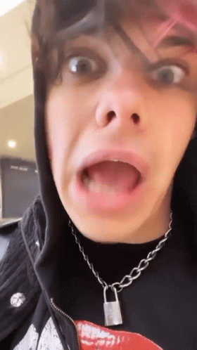 A Close Up Of A Person Making A Funny Face With Their Mouth Open . GIF