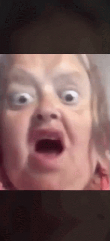 A Close Up Of A Person Making A Funny Face With Their Mouth Open . GIF