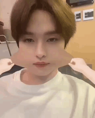 A Close Up Of A Person Making A Funny Face With Their Mouth Open . GIF