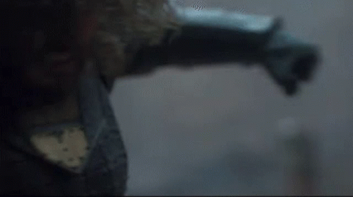 A Close Up Of A Person 'S Arm And Leg In A Dark Room . GIF