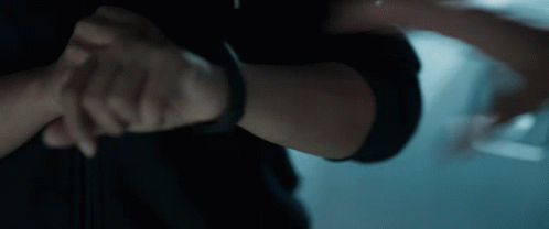 A Close Up Of A Person 'S Arm With A Black Watch On It GIF