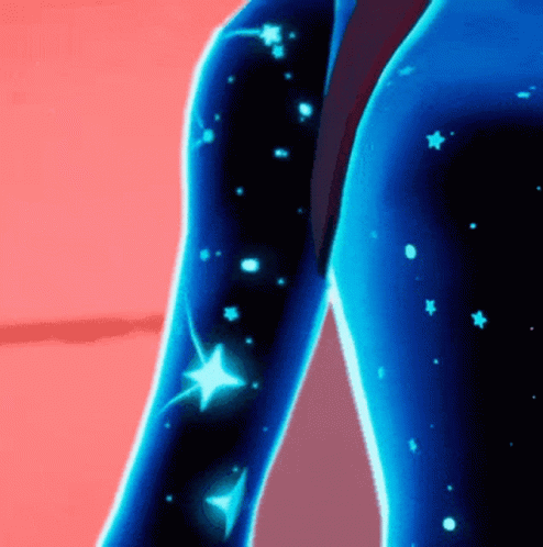 A Close Up Of A Person 'S Arm With Glowing Stars GIF