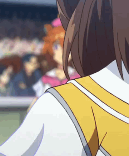 A Close Up Of A Person 'S Back With A Yellow Vest GIF