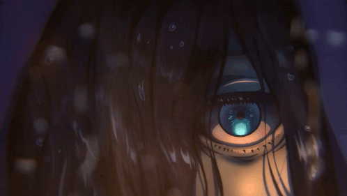 A Close Up Of A Person 'S Eye With A Blue Iris GIF