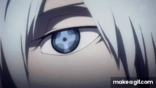 A Close Up Of A Person 'S Eye With A Blue Pupil And White Hair . GIF
