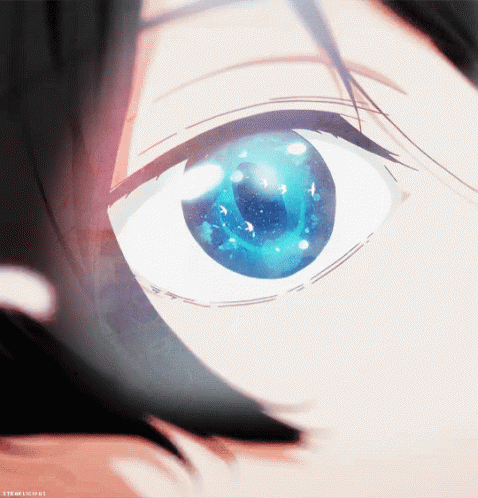 A Close Up Of A Person 'S Eye With A Galaxy In It GIF