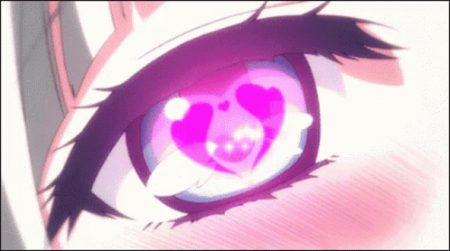 A Close Up Of A Person 'S Eye With A Heart In It . GIF